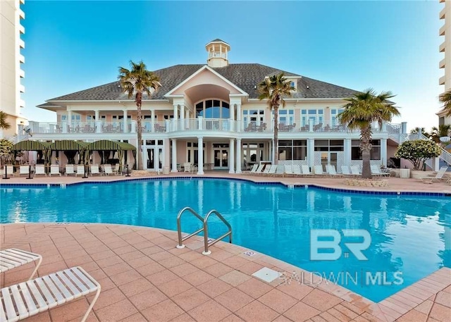 community pool with a patio