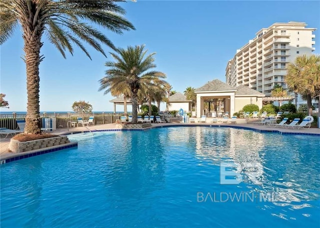 pool featuring a patio and fence