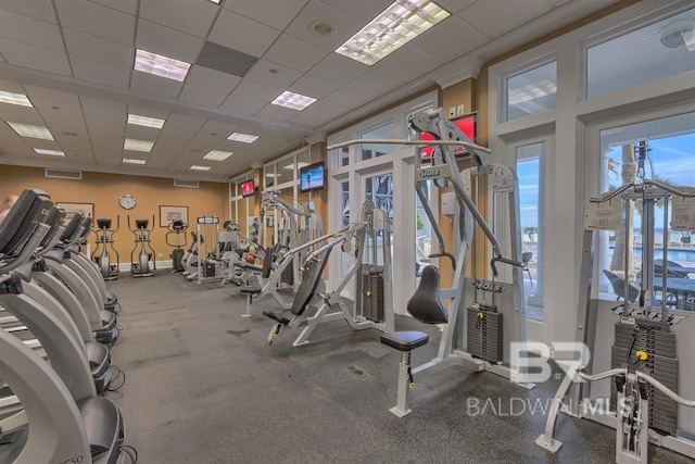 gym featuring visible vents and a paneled ceiling