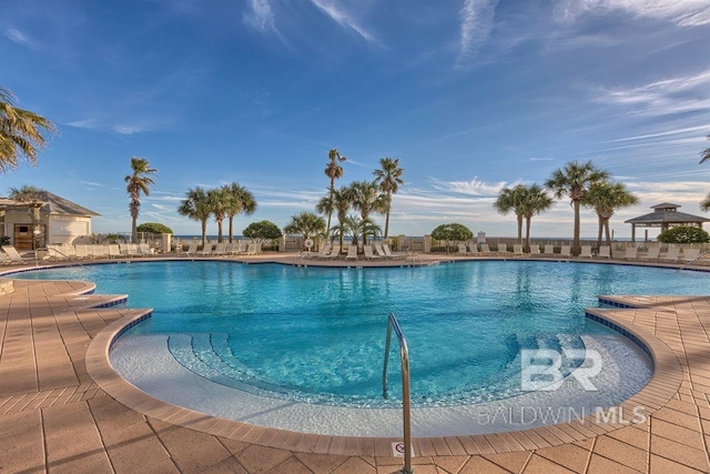 pool featuring a gazebo and a patio