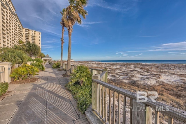 view of water feature featuring a gazebo and a beach view