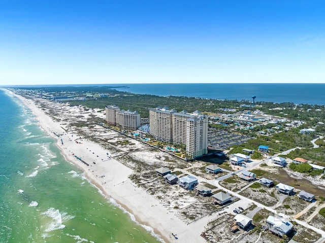 aerial view featuring a water view, a city view, and a beach view