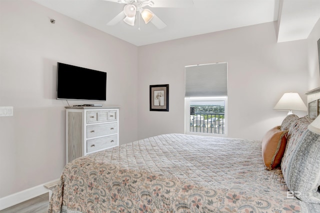 bedroom with hardwood / wood-style floors and ceiling fan