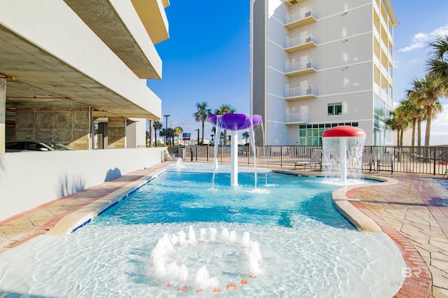 view of pool featuring pool water feature