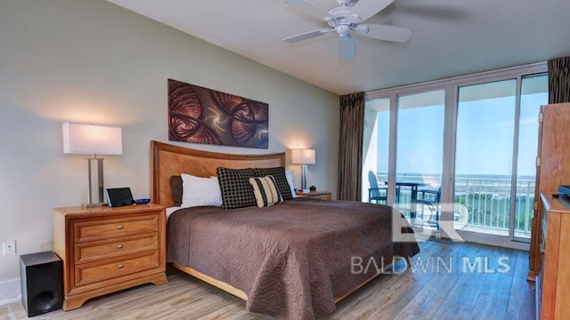28107 Perdido Beach Blvd Unit D615, Orange Beach, AL 36561 - bedroom with wood finished floors, access to outside, and a ceiling fan