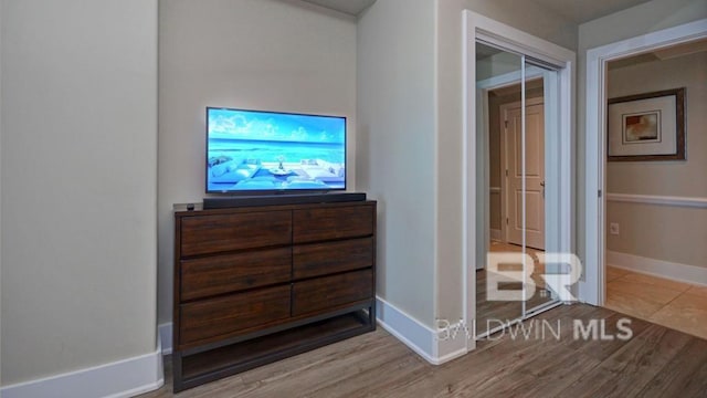 28107 Perdido Beach Blvd Unit D615, Orange Beach, AL 36561 - bedroom with baseboards and wood finished floors