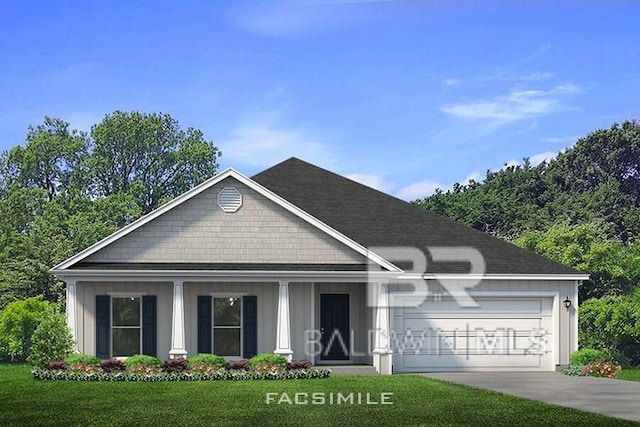 view of front of home with a garage and a front yard