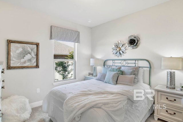 bedroom featuring light colored carpet