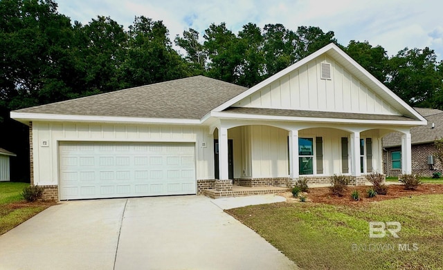 view of front of property featuring a garage and covered porch