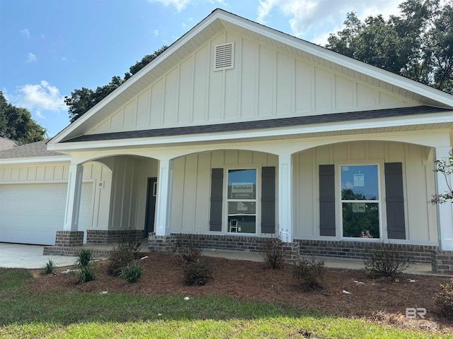 view of front of house featuring a garage and covered porch