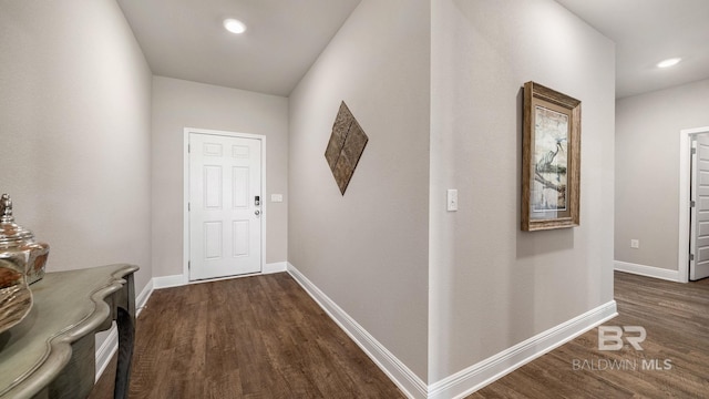 corridor featuring dark wood-type flooring