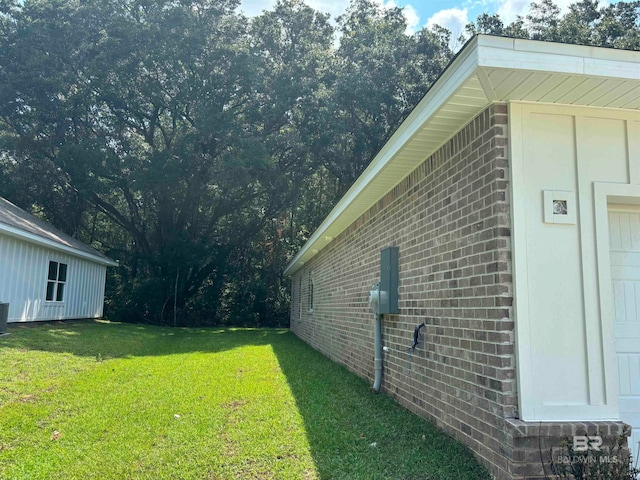 view of home's exterior with a yard