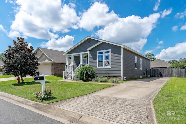 view of front facade featuring a garage and a front lawn