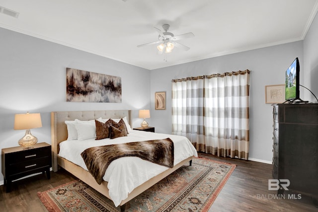 bedroom featuring ornamental molding, dark hardwood / wood-style floors, and ceiling fan