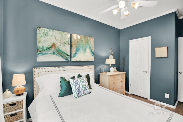 bedroom featuring ornamental molding, ceiling fan, and hardwood / wood-style flooring