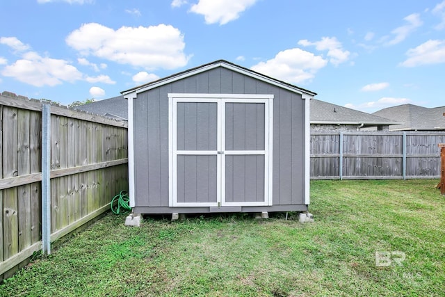 view of outbuilding featuring a yard