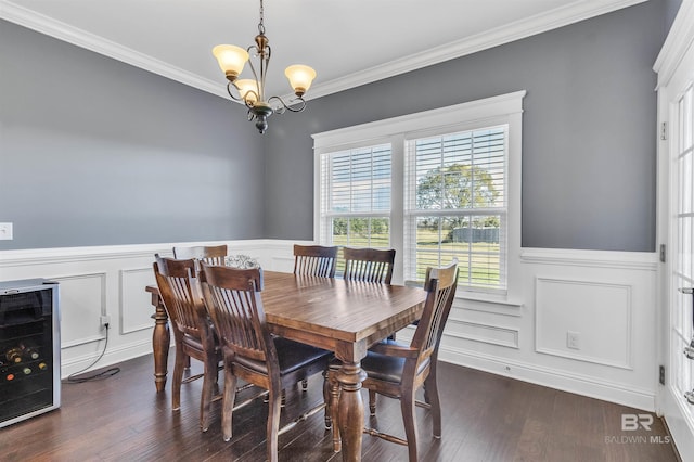 dining area with wine cooler, ornamental molding, dark wood finished floors, and a notable chandelier