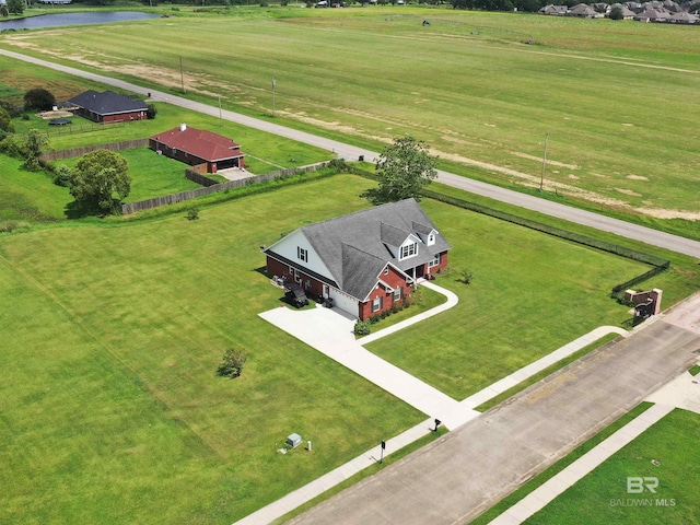 birds eye view of property featuring a rural view and a water view