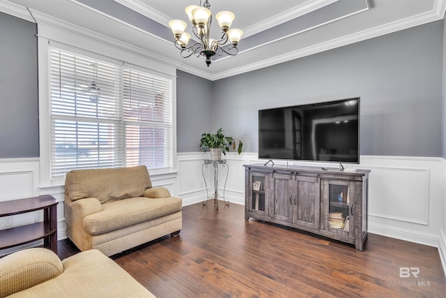 living area featuring dark wood-style flooring and wainscoting