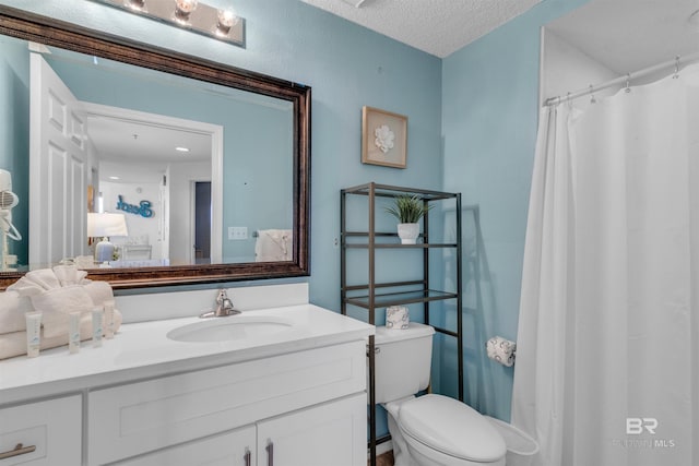 527 Beach Club Trl Unit C110, Gulf Shores, AL 36542 - bathroom featuring vanity, a textured ceiling, and a shower with curtain