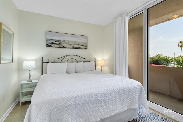527 Beach Club Trl Unit C110, Gulf Shores, AL 36542 - bedroom with light wood finished floors and access to outside