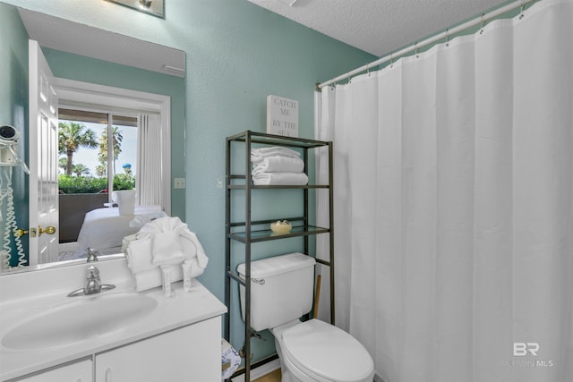 527 Beach Club Trl Unit C110, Gulf Shores, AL 36542 - full bath with vanity, ensuite bath, a textured ceiling, and a shower with curtain