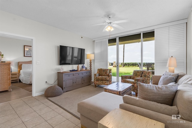 527 Beach Club Trl Unit C110, Gulf Shores, AL 36542 - living room featuring ceiling fan, floor to ceiling windows, and light tile patterned floors