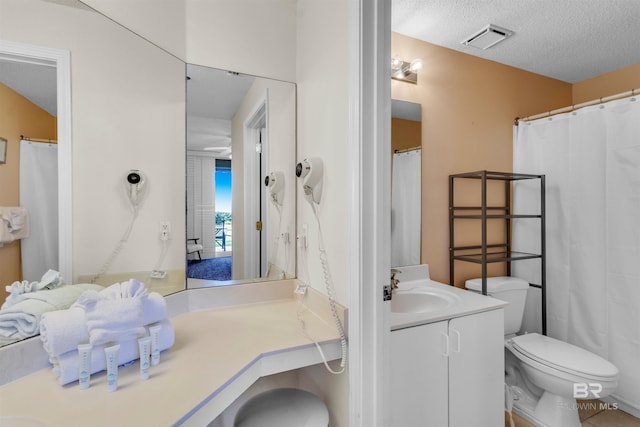 527 Beach Club Trl Unit C110, Gulf Shores, AL 36542 - bathroom with vanity and a textured ceiling