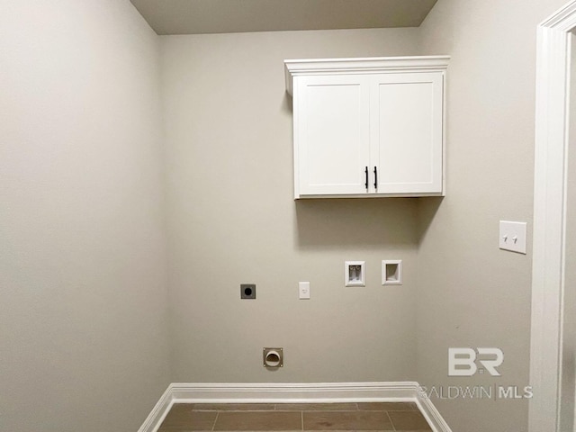 clothes washing area featuring hookup for a washing machine, electric dryer hookup, and baseboards