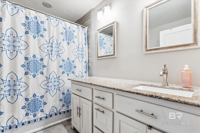 bathroom with vanity and shower / bathtub combination with curtain