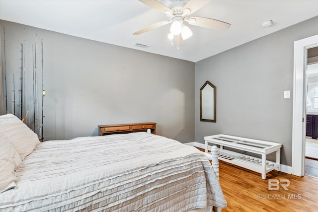 bedroom with ceiling fan and light hardwood / wood-style flooring