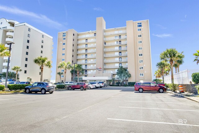 view of property featuring uncovered parking