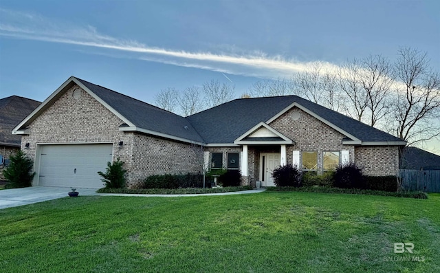 343 Stave Mill Rd, Fairhope, AL 36532 - view of front of home with brick siding, a front yard, and a garage