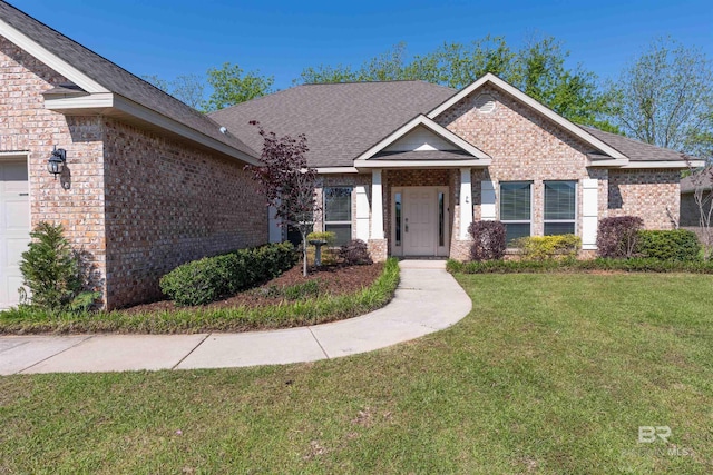 343 Stave Mill Rd, Fairhope, AL 36532 - view of front of home featuring brick siding, a shingled roof, and a front yard