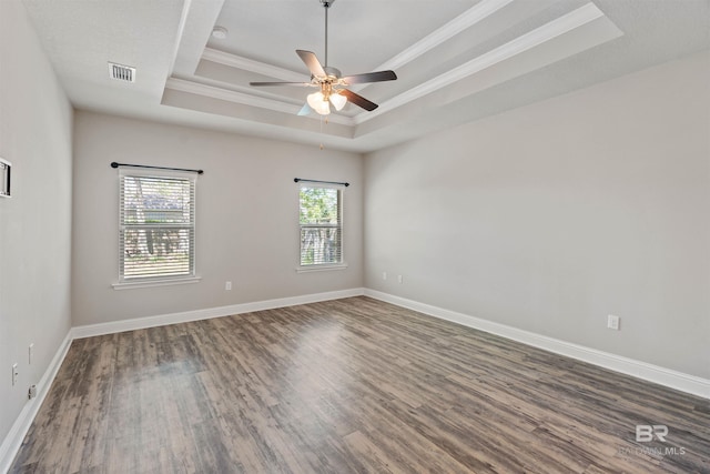343 Stave Mill Rd, Fairhope, AL 36532 - empty room with wood finished floors, ceiling fan, a tray ceiling, ornamental molding, and visible vents