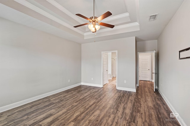 343 Stave Mill Rd, Fairhope, AL 36532 - unfurnished bedroom featuring baseboards, visible vents, a raised ceiling, and dark wood finished floors