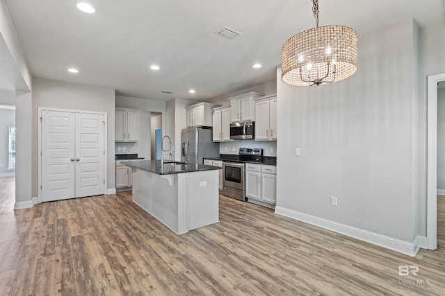 343 Stave Mill Rd, Fairhope, AL 36532 - kitchen with a sink, dark countertops, baseboards, visible vents, and appliances with stainless steel finishes