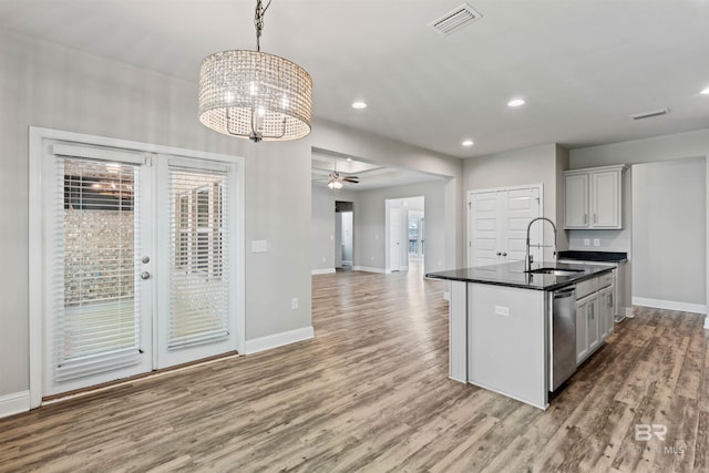 343 Stave Mill Rd, Fairhope, AL 36532 - kitchen featuring stainless steel dishwasher, wood finished floors, a sink, baseboards, and visible vents