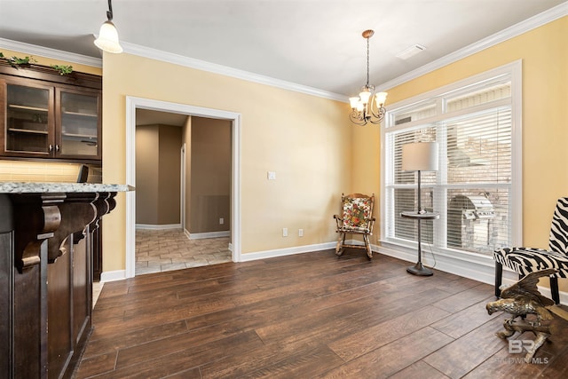 living area with dark hardwood / wood-style flooring, crown molding, and a notable chandelier