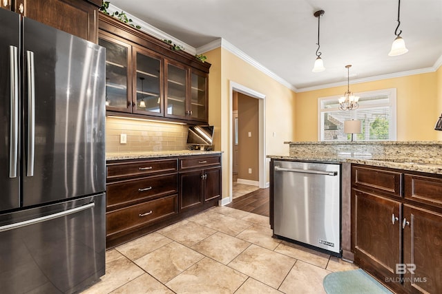 kitchen featuring ornamental molding, stainless steel appliances, dark brown cabinetry, and backsplash