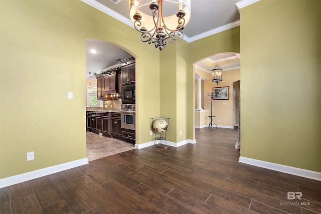 tiled empty room featuring a raised ceiling, an inviting chandelier, and ornamental molding