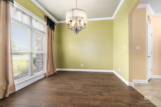 unfurnished room featuring a notable chandelier, tile floors, and ornamental molding