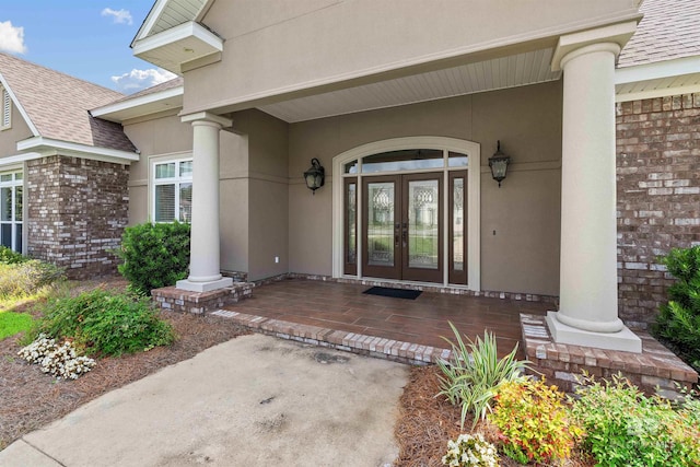 property entrance featuring french doors