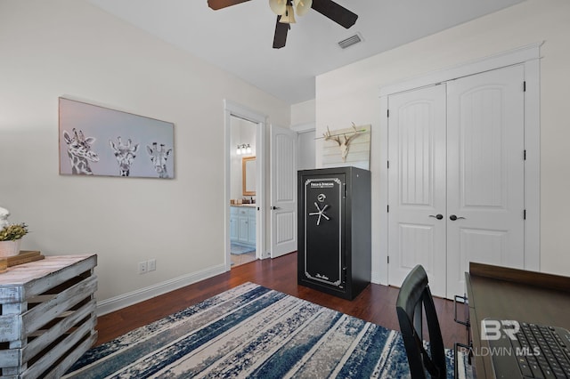 bedroom with dark wood finished floors, visible vents, a ceiling fan, a closet, and baseboards