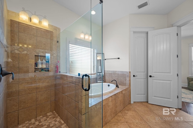 full bathroom featuring a shower stall, a bath, tile patterned flooring, and visible vents