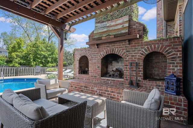 view of patio with fence and an outdoor living space with a fireplace
