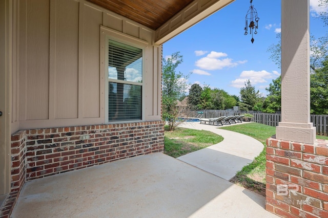 view of patio / terrace with a swimming pool and a fenced backyard