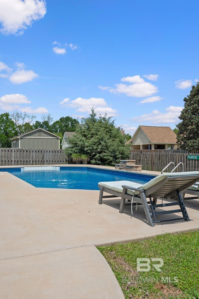 view of swimming pool with a patio area, a fenced in pool, fence, and a jacuzzi