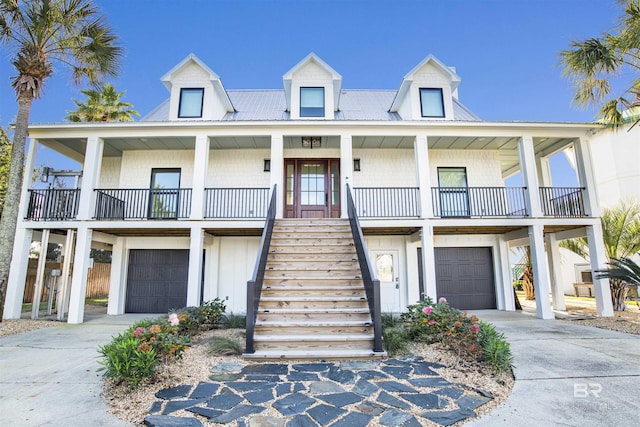 view of front of property featuring a garage and covered porch