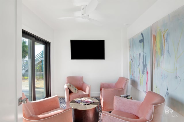 living area featuring ceiling fan